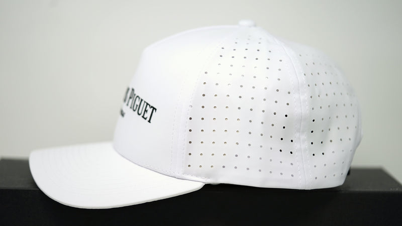 Side view of Audemars Piguet white logo cap with perforated breathable panels