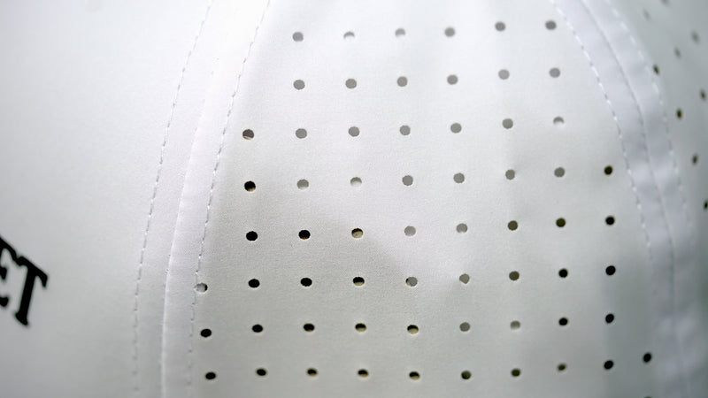Close-up view of Audemars Piguet white cotton perforated material
