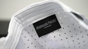 Inside view of Audemars Piguet white cotton hat with Le Brassus label