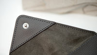 Close-up of Audemars Piguet leather pouch with embossed logo and premium stitching