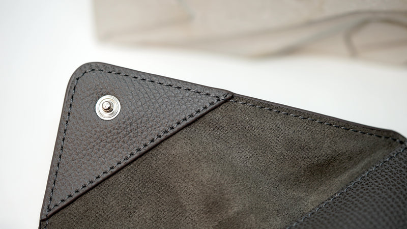 Close-up of Audemars Piguet leather pouch with embossed logo and premium stitching