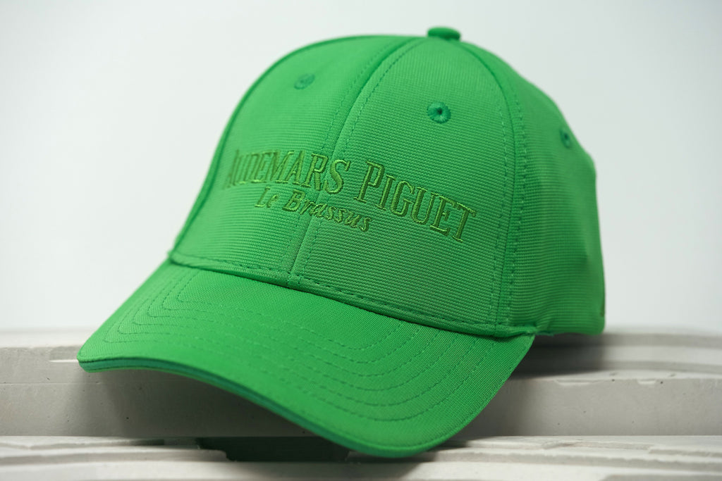 Front view of Audemars Piguet lime green Royal Oak sports hat with embroidered AP logo