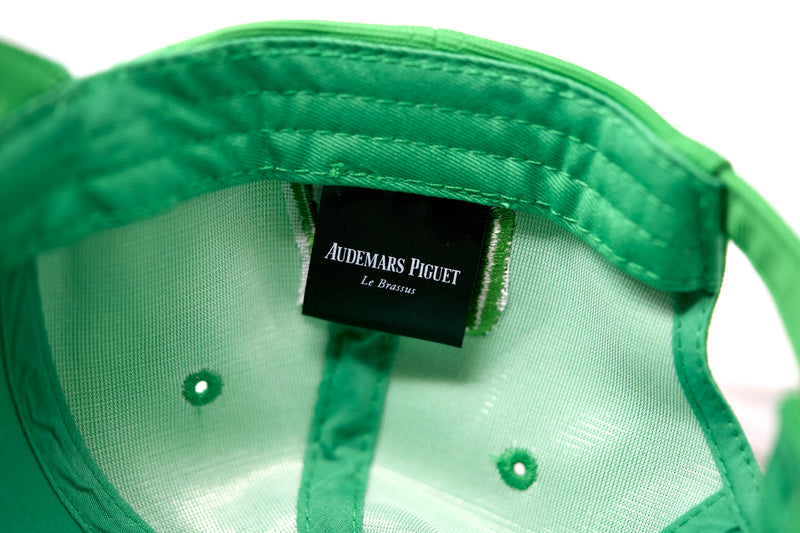 Interior view showing tag and premium stretch cotton lining inside Audemars Piguet lime hat