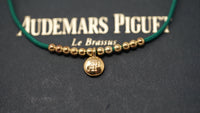 Audemars Piguet Gold Bracelet with Green Cord