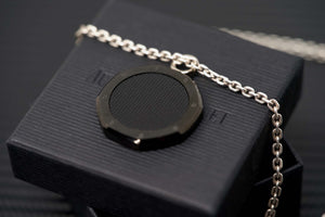 Audemars Piguet DLC carbon medallion pendant shown with chain bail opening