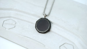 Detail of tapisserie engraved pattern on AP Royal Oak black medallion